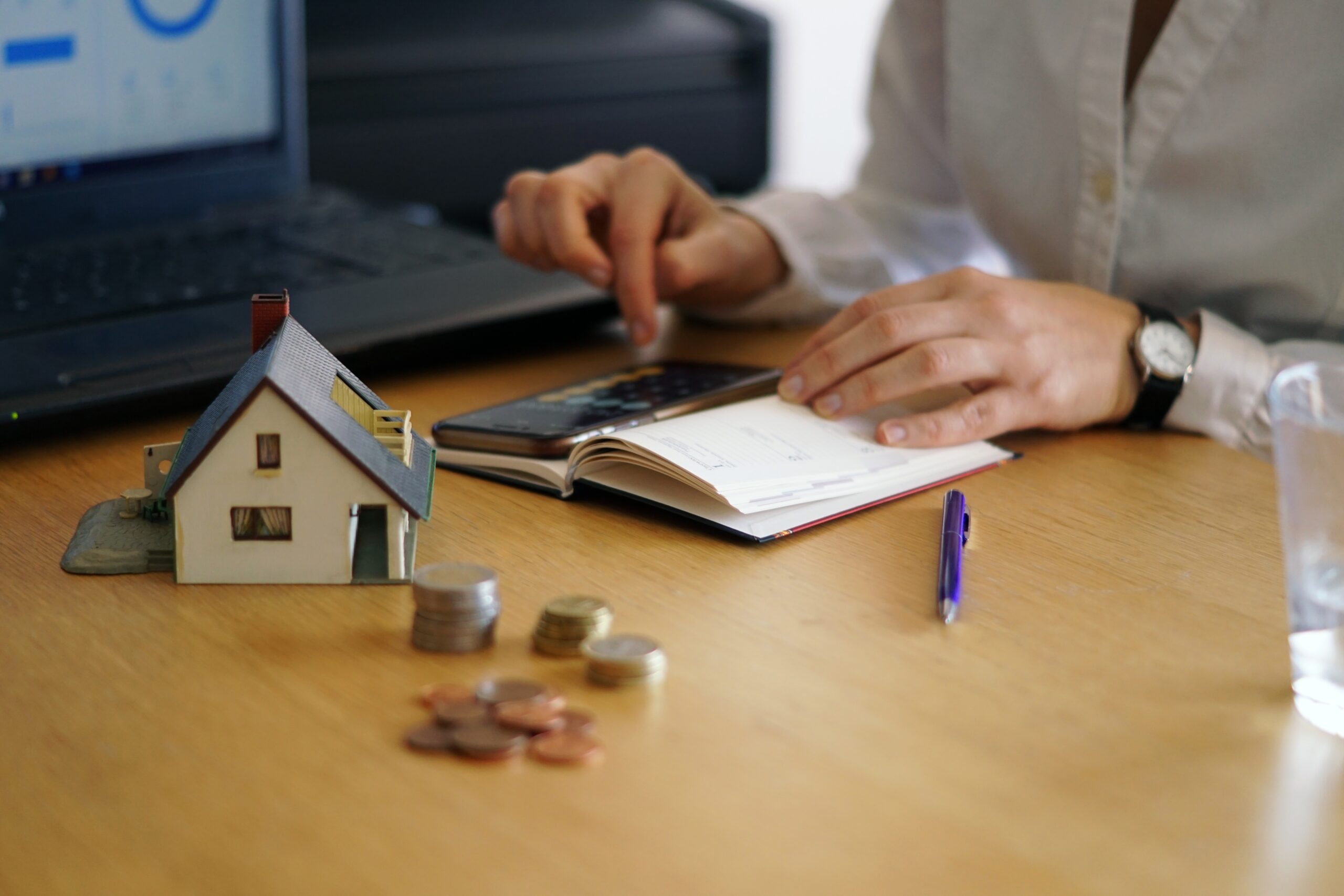 closeup shot of a person thinking of buying or selling a house scaled