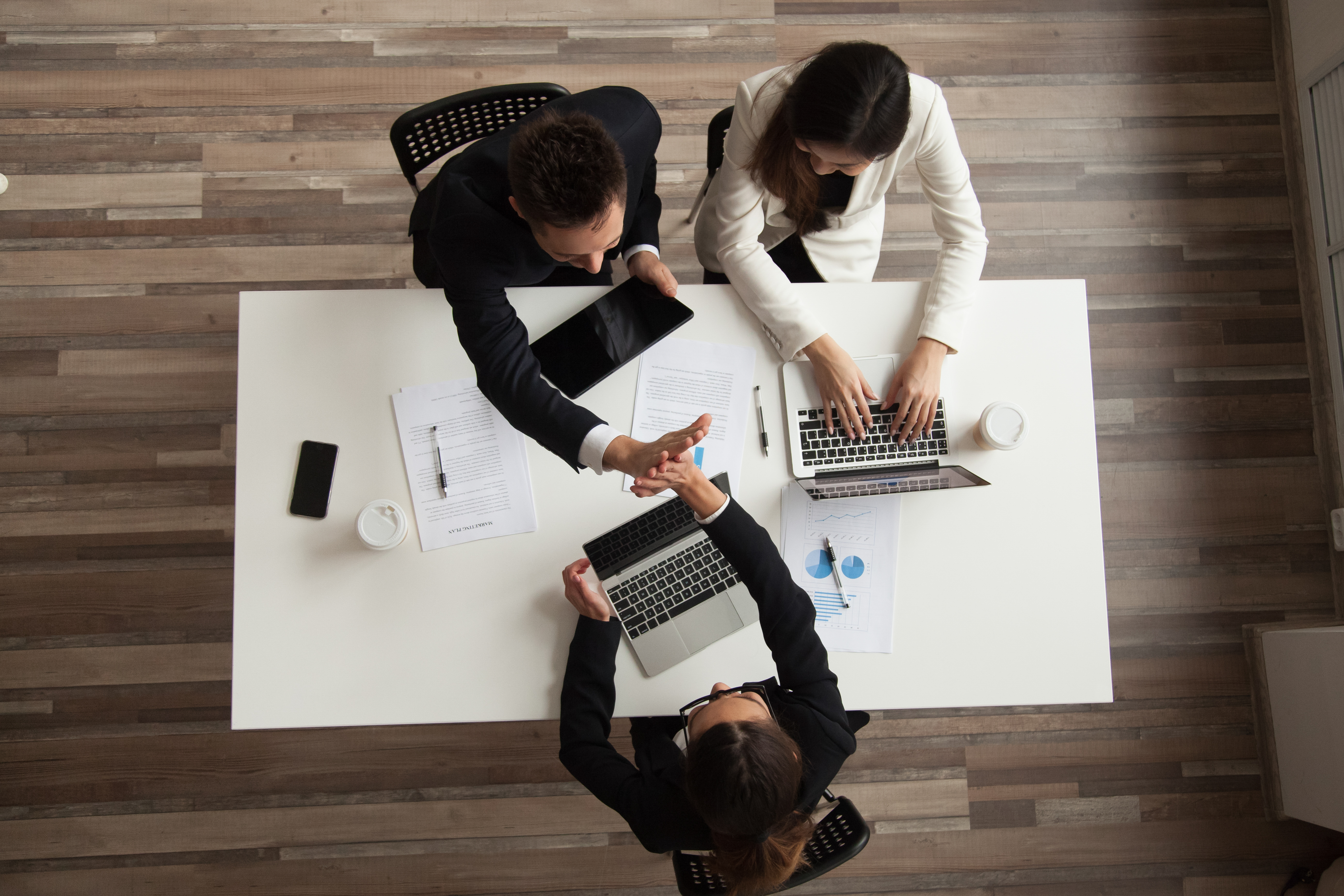 top view of worker giving high five to colleague