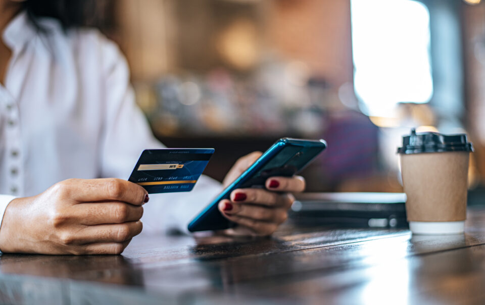 pay for goods by credit card through a smartphone in a coffee shop