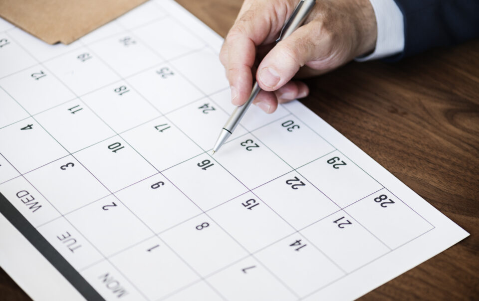 businessman marking calendar appointment