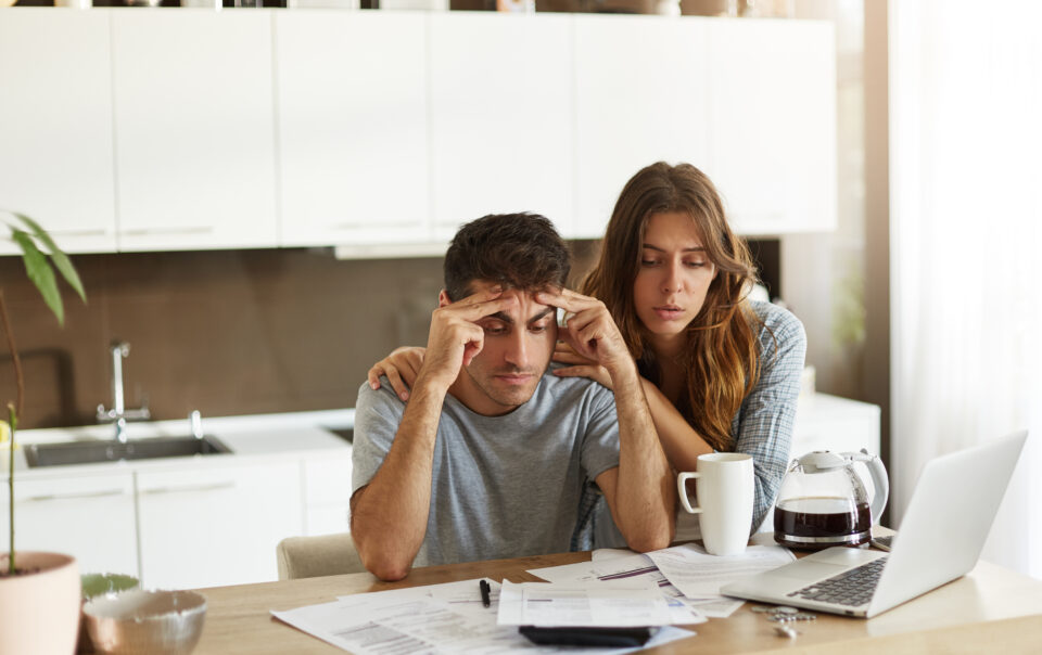 young couple checking their family budget