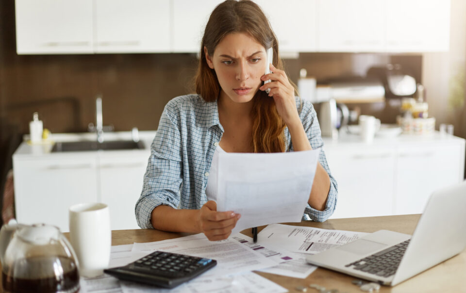 young woman checking her budget doing taxes