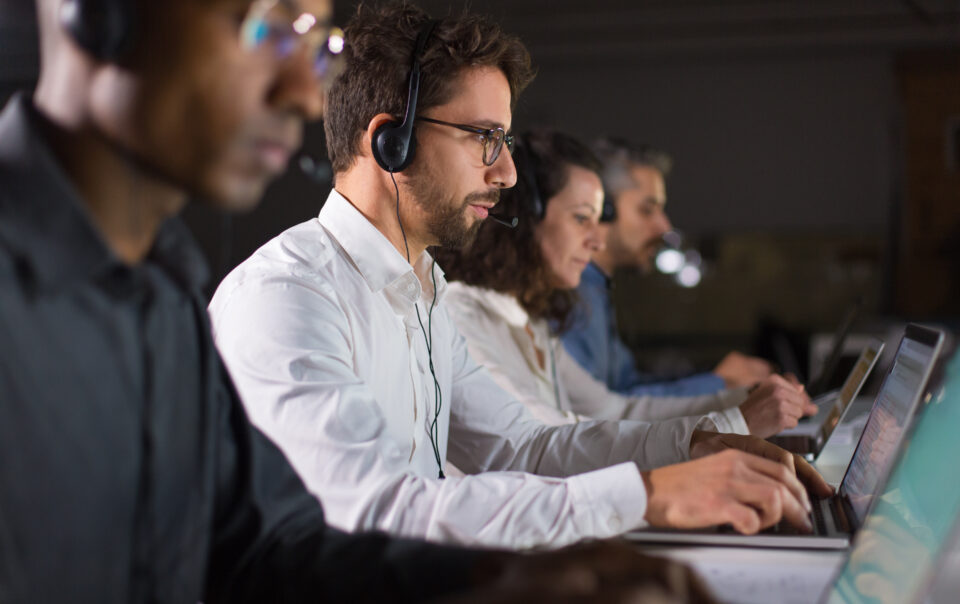 confident call center operator talking with client