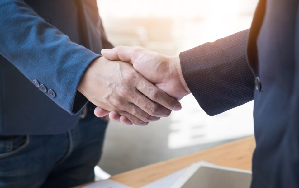 two confident business man shaking hands meeting office success dealing greeting partner concept