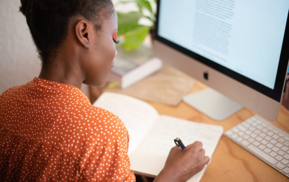 woman writing on her notebook 3059747